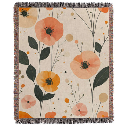 an orange and pink floral throw blanket on a white background