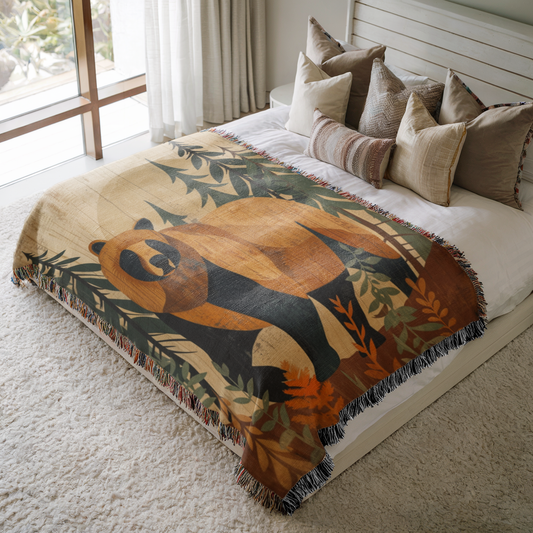 a bed with a bear blanket on top of it