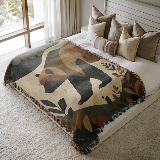 a bed covered in a blanket and pillows