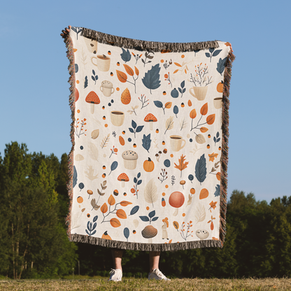 a person standing in a field holding a blanket