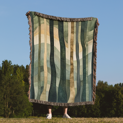 a person standing in a field holding a blanket