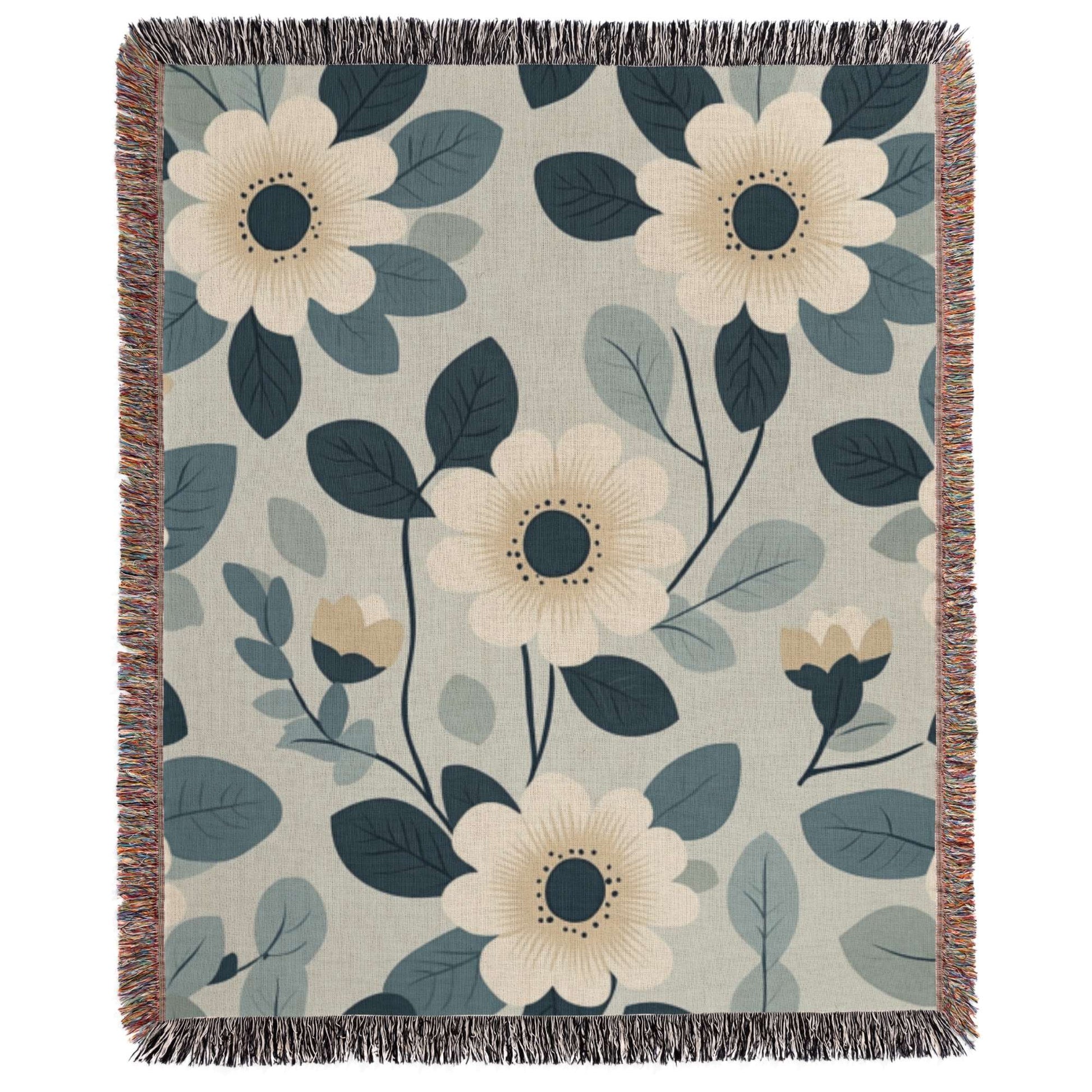 a blue and white blanket with flowers on it