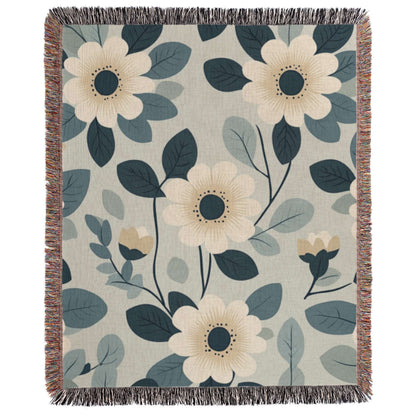 a blue and white blanket with flowers on it