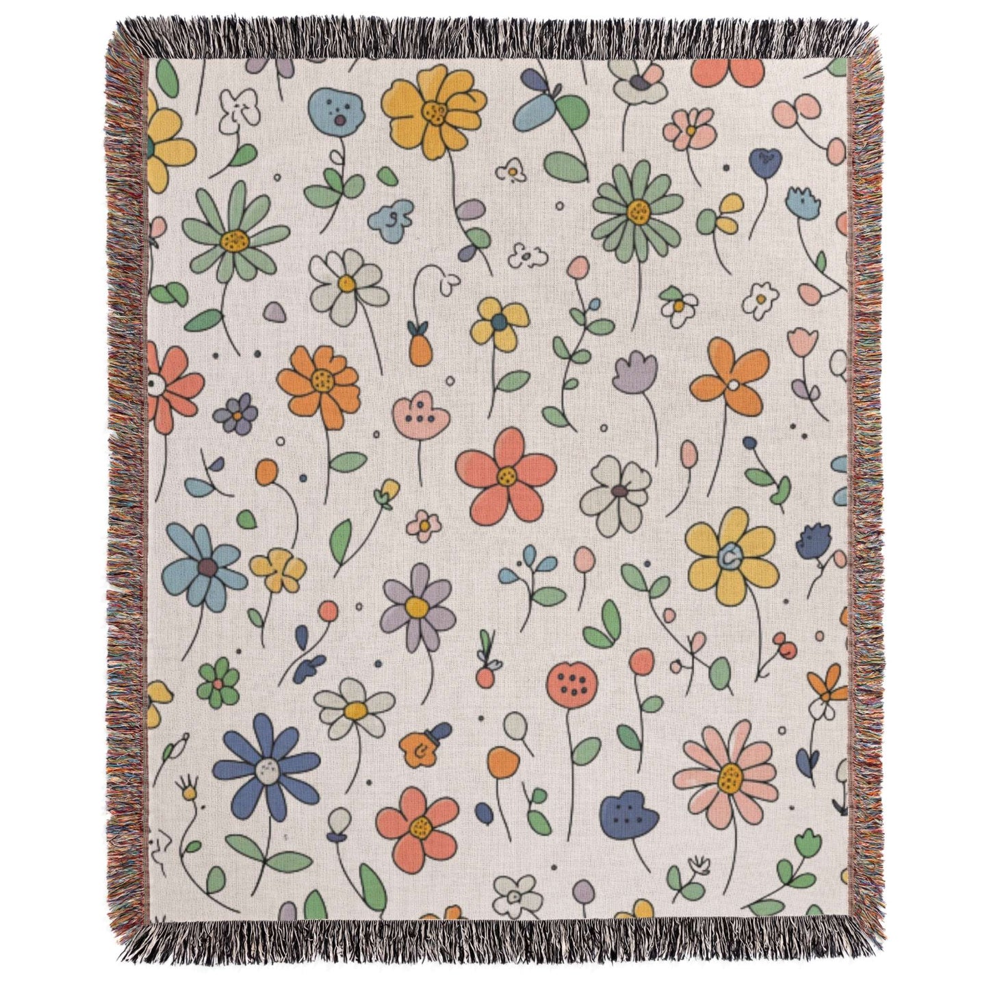 a white blanket with colorful flowers on it