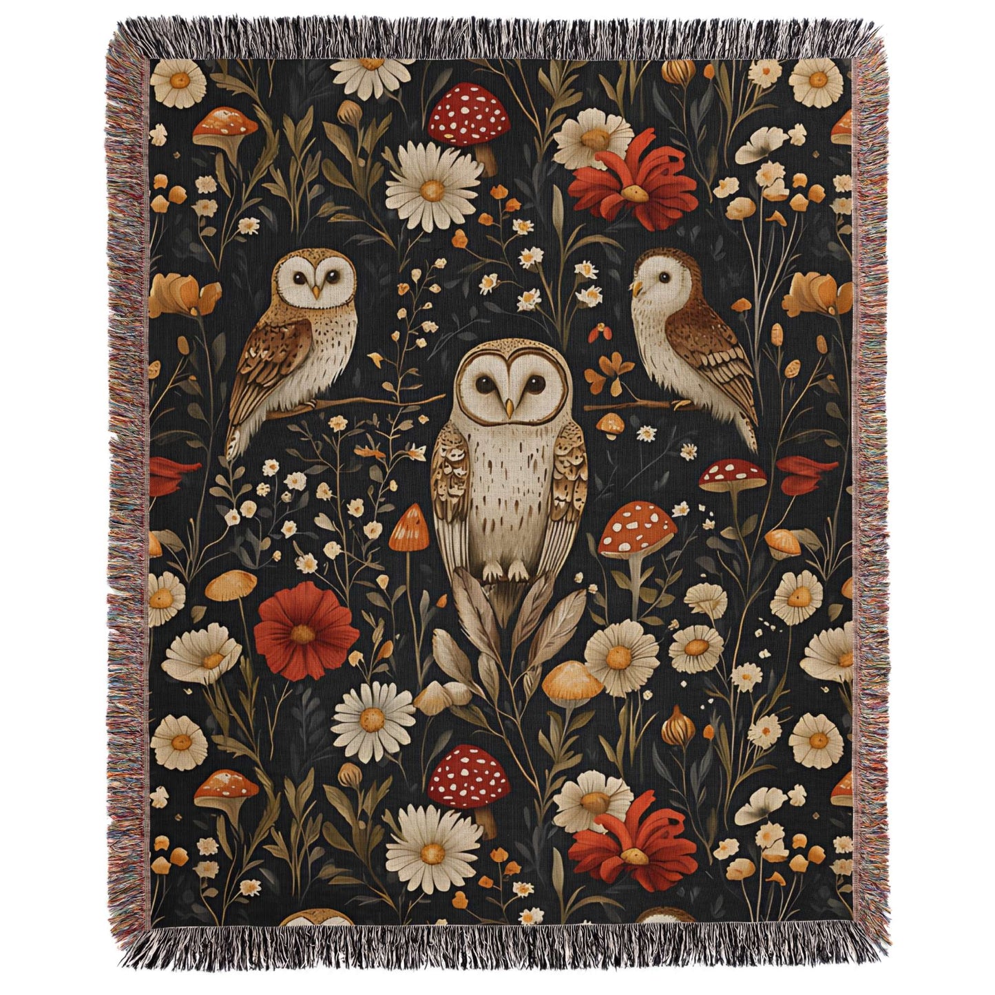 a tapestry with two owls and flowers on a black background