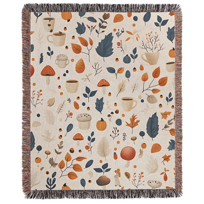 a blanket with a pattern of leaves and mushrooms