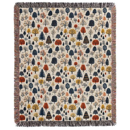 a blanket with trees and leaves on it