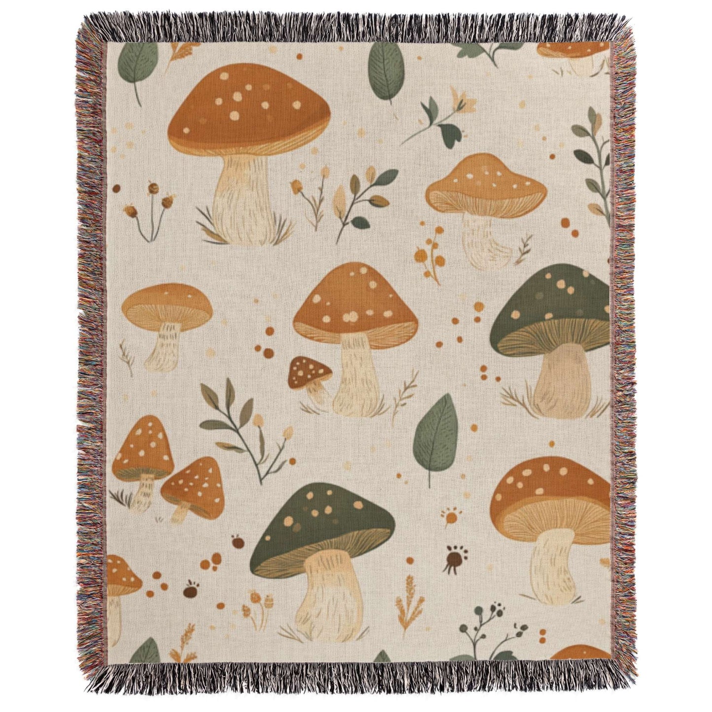 a blanket with mushrooms and leaves on it