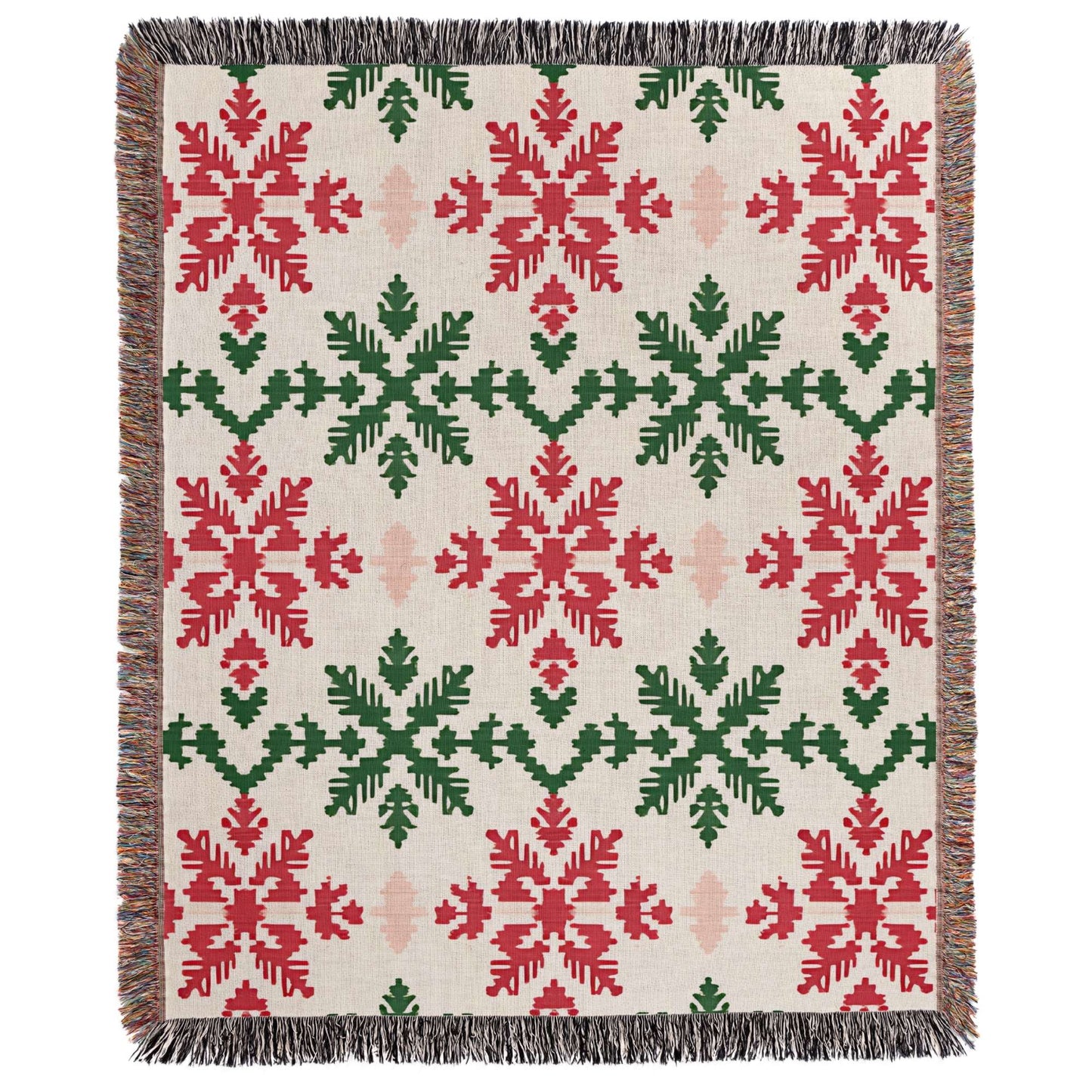 a red and green blanket with snowflakes on it