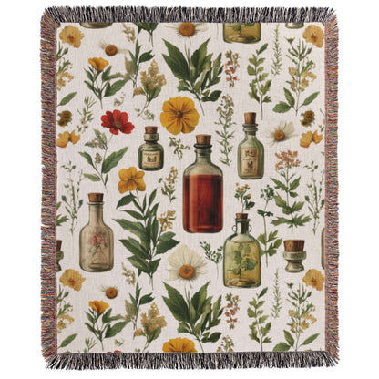 a blanket with a floral pattern and bottles on it