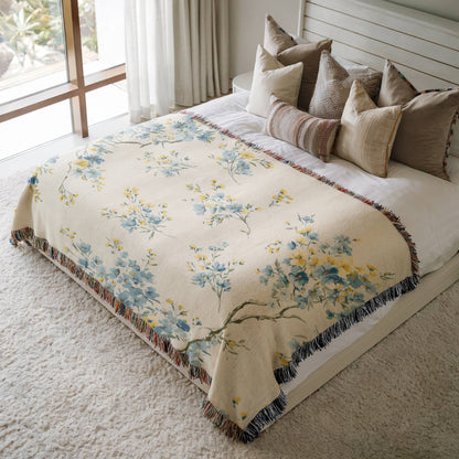 a bed with a floral comforter and pillows