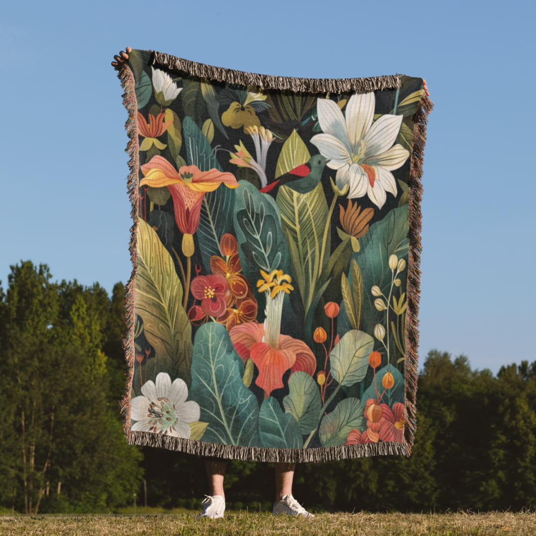 a woman standing in a field holding a blanket
